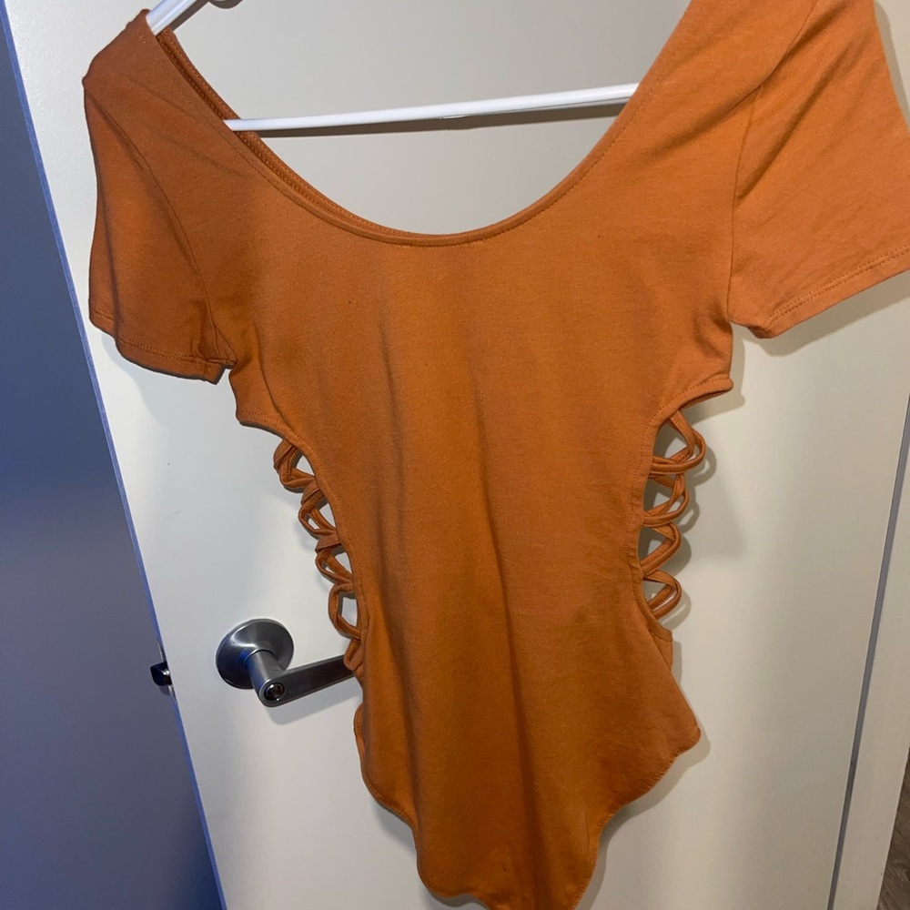 Body suit with open sides